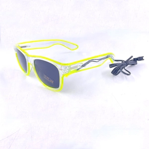 Detail of LED glowing party glasses in fluorescent green with external power cable