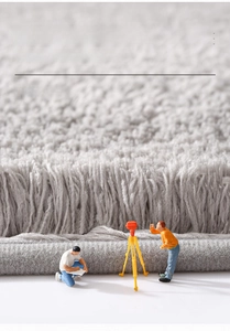 Macro detail of thick absorbent fiber structure on a soft grey bathroom floor mat