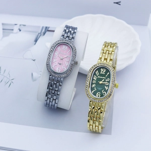 Elegant oval quartz watch with crystal bezel and metal band in gold and silver finish
