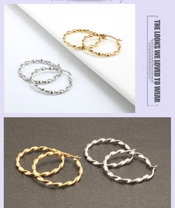 Detailed view of twisted rope hoop earrings in polished gold and silver metallic finishes