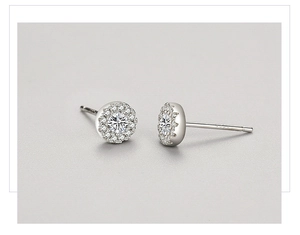 Macro shot of S925 sterling silver stamp on halo stud earrings with cubic zirconia