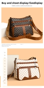 Detailed view of multi-zippered crossbody bags with classic monogram texture and leather trim