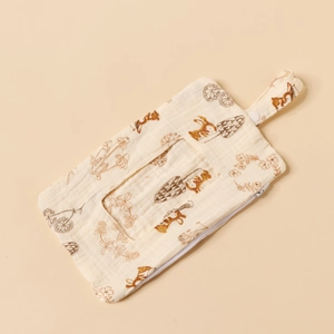 Detail of cotton muslin baby wipe pouch with cute animal prints and snap hanging strap