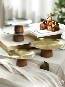 Elegant dessert display stands with walnut wood base and polished metal plates