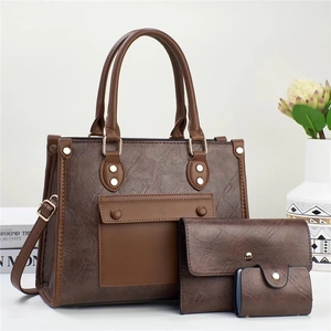 Three-piece set of dark brown vintage embossed tote bag, envelope clutch, and card holder
