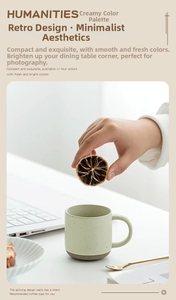 Detail of light green speckled ceramic espresso mug with brown stoneware base and handle