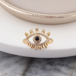 Macro shot of evil eye ring with black crystal and sparkling pave white stones