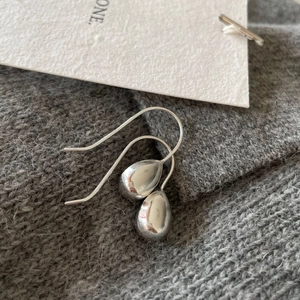 Minimalist 925 sterling silver teardrop earrings with a polished finish and long hook design