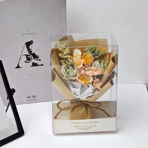Mini artificial rose bouquet in transparent PVC gift box with rustic kraft paper wrap