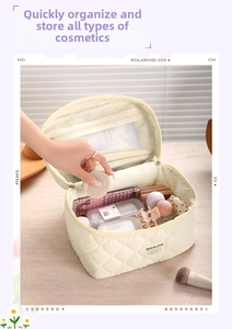 Macro view of cream quilted makeup bag with interior mesh pocket for cosmetics