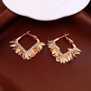 Bohemian 18K gold plated D-shaped hoop earrings with dangling metallic leaf charms