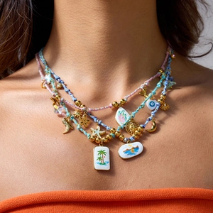 Chic 18K gold-plated beaded necklace with colorful charms and bohemian style vacation vibes