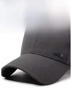 Detail of a dark grey structured baseball cap showing durable twill fabric and stiff brim