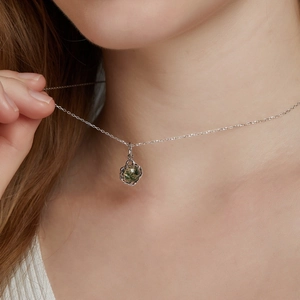 Elegant S925 silver necklace with green moss agate pendant on a model neck