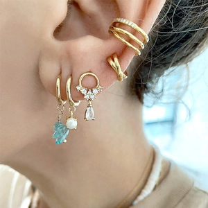 S925 silver needle water drop earring set with gold pearls and zircon on female model