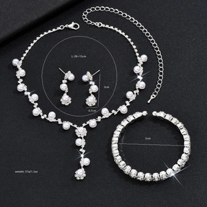 Detail view of pearl jewelry set with necklace, earrings, bracelet and size parameters