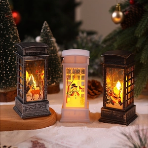 Three LED Christmas telephone booth lanterns with reindeer, snowman and Santa motifs