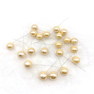 Macro view of champagne gold artificial pearl berry stems for Christmas DIY decoration
