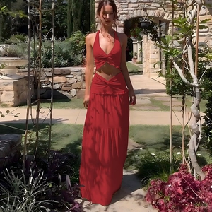Detail of red summer two-piece set featuring V-neck crop top and tiered bohemian skirt