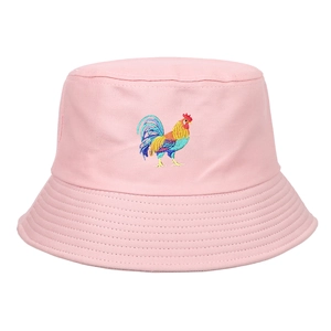 Close-up of pink cotton bucket hat with colorful rooster embroidery and stitched brim