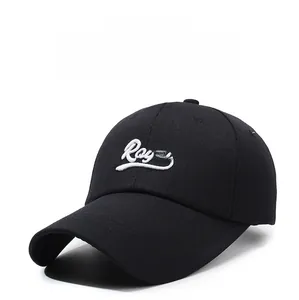 Detail of white Royal 3D embroidery on a premium black cotton baseball cap