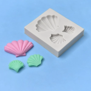 Shell shaped silicone mold for DIY crafts with three distinct seashell cavity designs