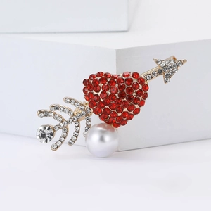 Exquisite gold heart and arrow brooch with red rhinestones and white pearl detail