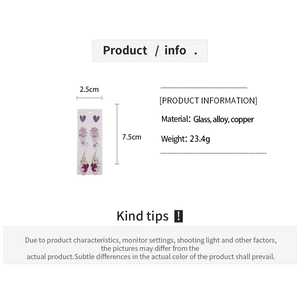 Detail of purple and white floral drop earrings with dimensions and material specifications