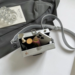 Retro camera-shaped silver hard shell box bag with metallic strap and spacious interior