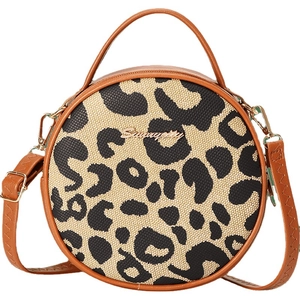 Fashionable round leopard print crossbody bag with brown leather trim and top handle