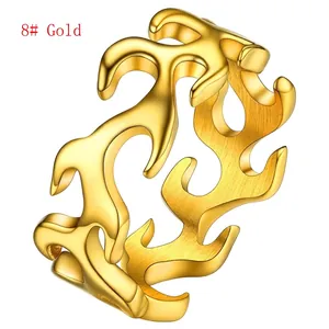 Macro shot of gold flame ring showing brushed metal finish and detailed镂空 cutout texture