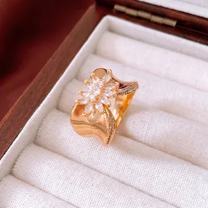 Luxurious 18K gold plated flower ring with white marquise zircons in a jewelry box