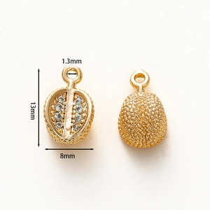 Detail view of 18k gold plated durian charm with cubic zirconia for jewelry making