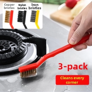 Close-up of three-piece multi-functional cleaning brush set for stove corners