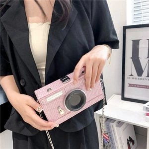 Pink camera-shaped crossbody bag with metal chain strap and creative glitter texture