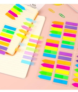 Close-up of colorful waterproof arrow PET index tabs applied on a notebook page