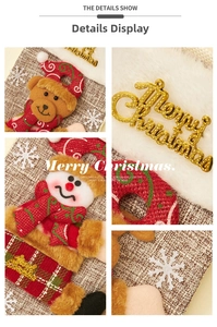 Detail of burlap Christmas stocking with 3D teddy bear and soft faux fur cuff trim