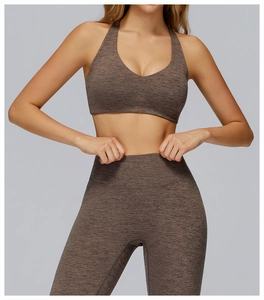 Detail of high-waist marled yoga leggings and v-neck bra set in seamless knitted fabric