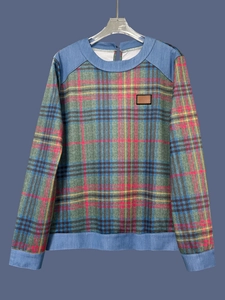 Detail of plaid patchwork sweatshirt with denim stitching and round neck design