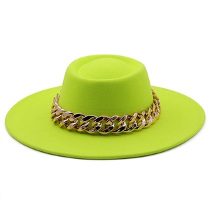 Detailed view of fluorescent green felt hat with a bold decorative gold chain link band