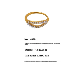 Detail of gold double-layer stainless steel ring with shell pearl and zircon, size 7