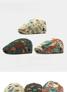 Detailed view of three vintage beret caps with butterfly patterns and pop art prints