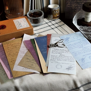 Vintage aesthetic scrapbook paper pack with antique textures and metal clip for journaling