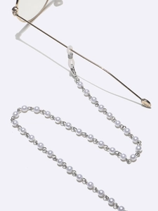 Detailed view of pearl eyewear chain with silicone loops and metallic clasp closure