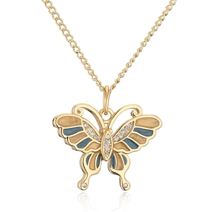 Macro view of butterfly pendant with blue and beige enamel and sparkling crystals