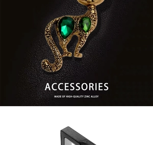 Detail of vintage cat brooch made of high-quality zinc alloy with green crystals