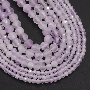 Macro shot of multiple strands of faceted purple crystal beads for DIY jewelry making