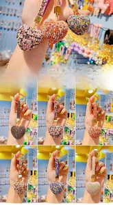 Detailed view of heart-shaped keychains with colorful rhinestones and metal lobster clasp