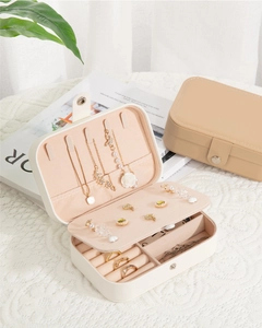 Detail of portable jewelry box with velvet lining, hooks for necklaces and ring slots