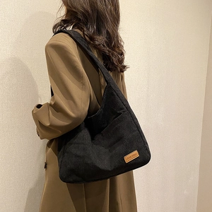 Large black corduroy tote bag for women with shoulder strap and front pocket